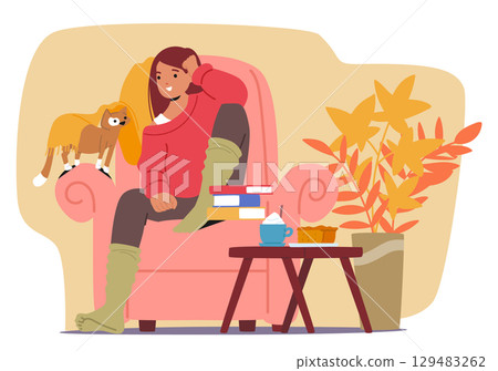 Young woman wearing warm autumn clothes sitting in armchair resting enjoying peaceful seasonal time 129483262