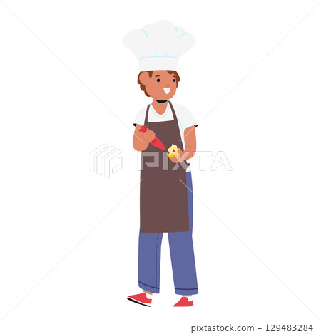 Boy child cartoon character baking muffins decorating pastry with icing glaze full-length portrait 129483284