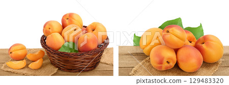 apricot fruit in Wicker basket on wooden table isolated on white background. Clipping path and full depth of field 129483320