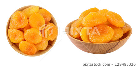 Dried apricots in wooden bowl isolated on white background with  full depth of field. Top view. Flat lay Dried apricots in wooden bowl isolated on white background with  full depth of field. Top view. Flat lay 129483326