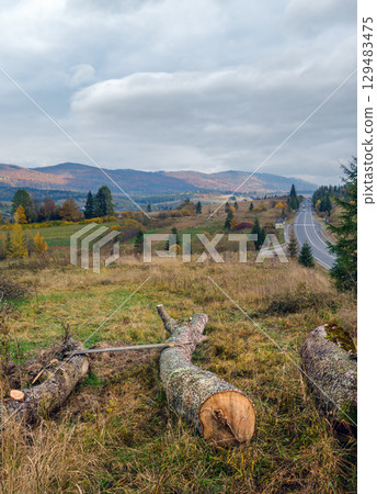 Cloudy autumn Carpathian Mountains and highway on mountain pass, Ukraine. Cloudy autumn Carpathian Mountains and highway on mountain pass, Ukraine. 129483475
