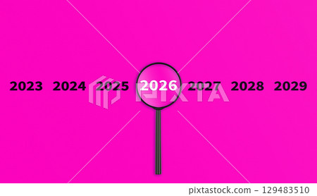Lens, magnifying glass focusing on the year 2026 on a Pink background. Financial or stock market strategies and past and future events. Lens, magnifying glass focusing on the year 2026 on a Pink background. Financial or stock market strategies and past and future events. 129483510