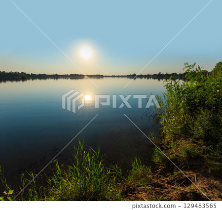 Summer sunset lake calm beach Summer sunset lake calm beach 129483565