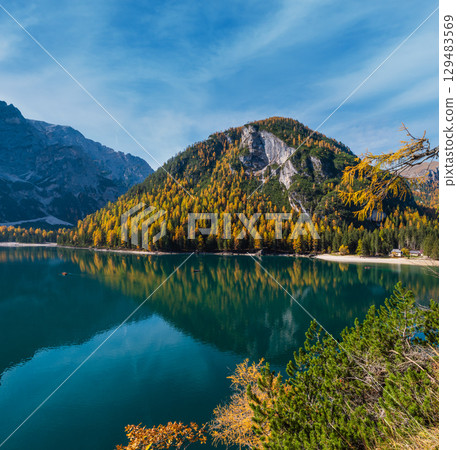 Autumn peaceful alpine lake Braies or Pragser Wildsee. Fanes-Sennes-Prags national park, South Tyrol, Dolomites Alps, Italy, Europe. Autumn peaceful alpine lake Braies or Pragser Wildsee. Fanes-Sennes-Prags national park, South Tyrol, Dolomites Alps, Italy, Europe. 129483569