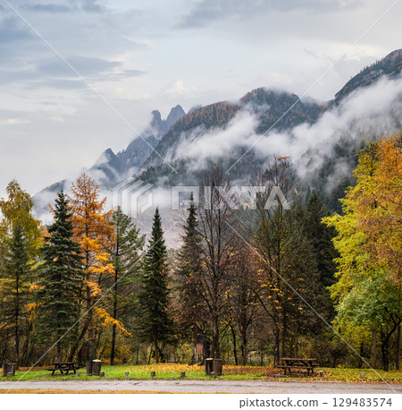Cloudy and foggy autumn alpine mountain scene. Austrian Lienzer Dolomiten Alps. Cloudy and foggy autumn alpine mountain scene. Austrian Lienzer Dolomiten Alps. 129483574