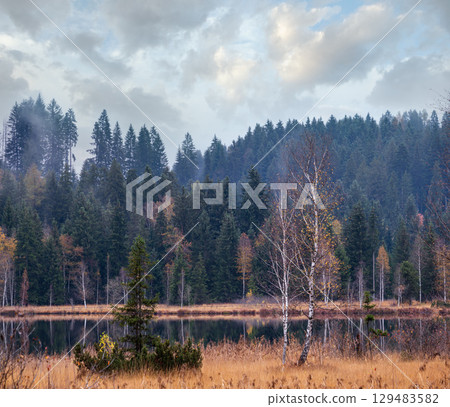 Mountain alpine autumn lake Schwarzsee, Kitzbuhel, Tirol, Austria Alps. 129483582