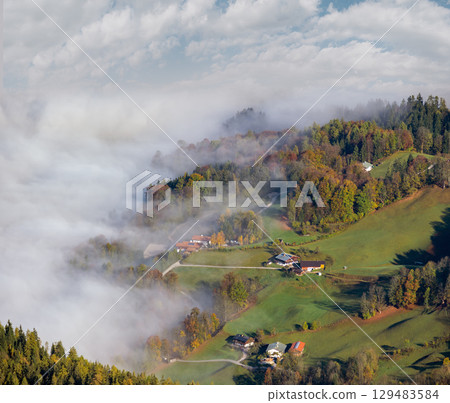 Autumn Alps mountain misty morning view from Jenner Viewing Platform, Schonau am Konigssee, Bavaria, Germany. 129483584