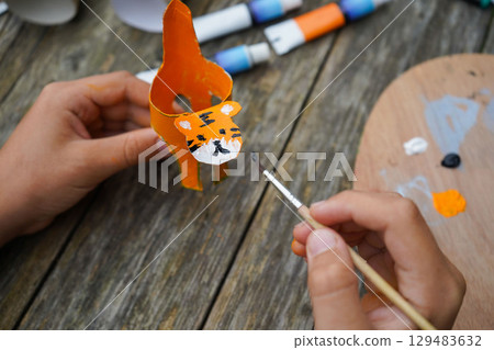 DIY and kid's creativity. Step by step instruction: how to make tiger from toilet roll tube. Step five: draw the tiger's face. DIY and kid's creativity. Step by step instruction: how to make tiger from toilet roll tube. Step five: draw the tiger's face. 129483632