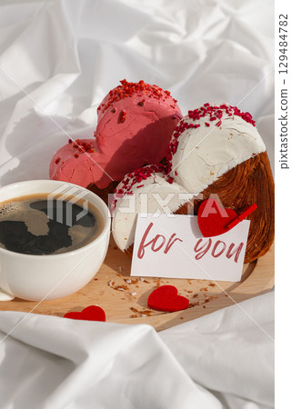 FOR YOU text message paper note card Morning breakfast Valentine's Day Birthday celebration Delicious fresh variety croissants topped with colorful flavor Ganache. Creation unique heart shape bakery 129484782