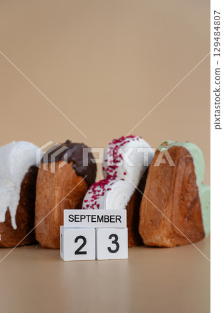Calendar date 23 September national baker day greeting card Delicious fresh croissant topped with colorful flavor Ganache. Creation unique heart shape bakery. Puff pastry holiday love gift present 129484807