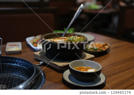 Tofu delicious soup. Hot boiling Korean spicy soft tofu stew, Sundubu jjigae 129485174