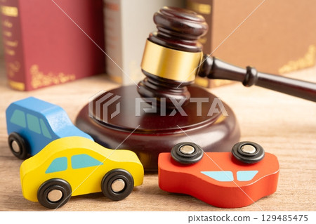 Car accident lawsuit and insurance, Judge hammer with car model. Car accident lawsuit and insurance, Judge hammer with car model. 129485475