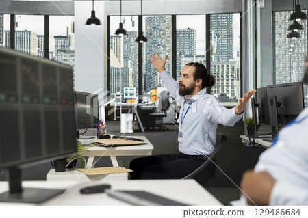 Trader distressed by stock market crash triggered by Black Swan event causing drops in share prices. Financial expert frustrated by recession news decreasing market liquidity and causing losses Trader distressed by stock market crash triggered by Black Swan event causing drops in share prices. Financial expert frustrated by recession news decreasing market liquidity and causing losses 129486684