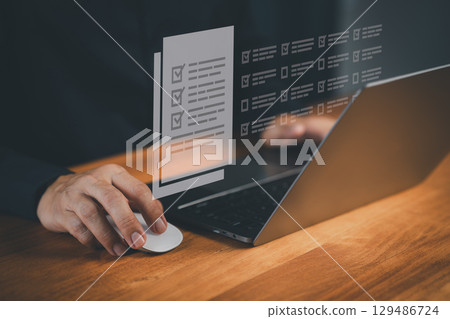 Digital checklist and online survey form shown on a laptop as a user completes tasks, illustrating workflow approval, enhanced productivity, and streamlined data submission in a modern digital. Digital checklist and online survey form shown on a laptop as a user completes tasks, illustrating workflow approval, enhanced productivity, and streamlined data submission in a modern digital. 129486724