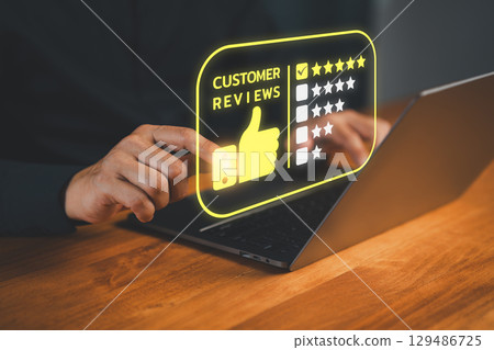 Customer select five star icon from a feedback. Business concept of customer service satisfaction, testimonial review, service quality, and positive user experience in an online feedback system. Customer select five star icon from a feedback. Business concept of customer service satisfaction, testimonial review, service quality, and positive user experience in an online feedback system. 129486725