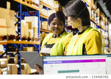Small business warehouse staff works to deliver online orders, and handle shipments for local brand. With express delivery services and in-house operations, ensure fast fulfillment for customers. Small business warehouse staff works to deliver online orders, and handle shipments for local brand. With express delivery services and in-house operations, ensure fast fulfillment for customers. 129486768