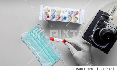 Researcher holding a blood test tube infected with monkeypox virus (MPOX). Monkeypox disease Researcher holding a blood test tube infected with monkeypox virus (MPOX). Monkeypox disease 129487471