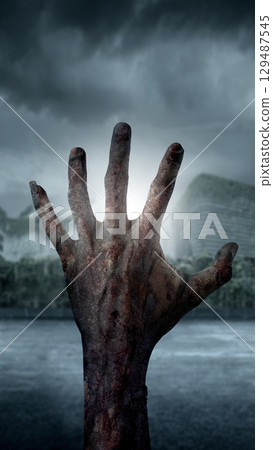 Zombie hand with bloody wound rising out of the ground with a moonlight background. Hand appearing to be a devil, evil, satan, or a monster hand. Concept of Spooky Halloween Zombie hand with bloody wound rising out of the ground with a moonlight background. Hand appearing to be a devil, evil, satan, or a monster hand. Concept of Spooky Halloween 129487545