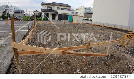 Vacant lot where foundation work has begun 129487574