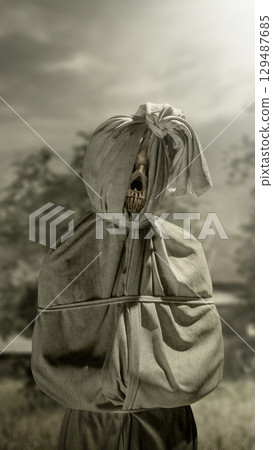 Pocong on the field at night. A traditional ghost from Indonesia that takes the form of a human wrapped in a shroud or winding sheet. Concept of Halloween Pocong on the field at night. A traditional ghost from Indonesia that takes the form of a human wrapped in a shroud or winding sheet. Concept of Halloween 129487685