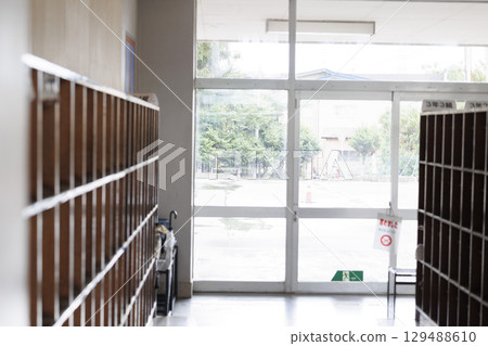 An empty elementary school hallway, entrance 129488610