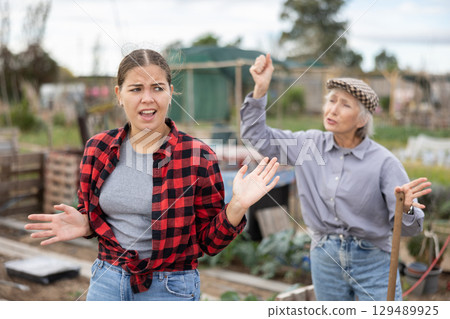 Conflict between female neighbors in country farm Conflict between female neighbors in country farm 129489925
