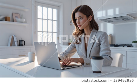 The desk environment of a working woman who works from home and prepares documents 129492956