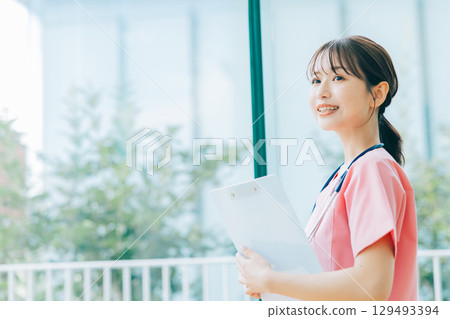 Smiling female nurse Smiling female nurse 129493394