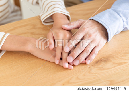 A father comforting a depressed middle school girl 129493449