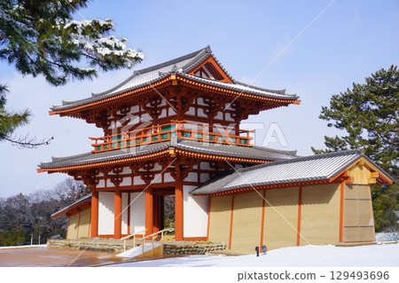The snow-covered south gate of Taga Castle under restoration 129493696