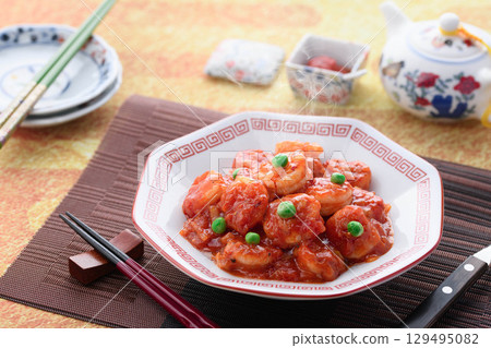 Glossy and fragrant shrimp chili. A classic Chinese dish. Colorful stir-fried shrimp in chili sauce. Perfect for advertising. Glossy and fragrant shrimp chili. A classic Chinese dish. Colorful stir-fried shrimp in chili sauce. Perfect for advertising. 129495082