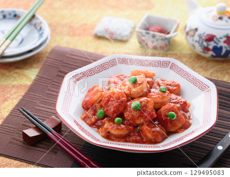 Glossy and fragrant shrimp chili. A classic Chinese dish. Colorful stir-fried shrimp in chili sauce. Perfect for advertising. Glossy and fragrant shrimp chili. A classic Chinese dish. Colorful stir-fried shrimp in chili sauce. Perfect for advertising. 129495083