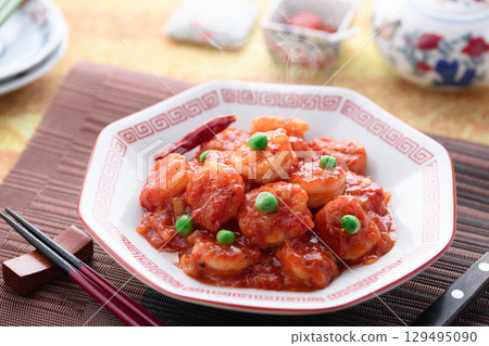 Glossy and fragrant shrimp chili. A classic Chinese dish. Colorful stir-fried shrimp in chili sauce. Perfect for advertising. Glossy and fragrant shrimp chili. A classic Chinese dish. Colorful stir-fried shrimp in chili sauce. Perfect for advertising. 129495090