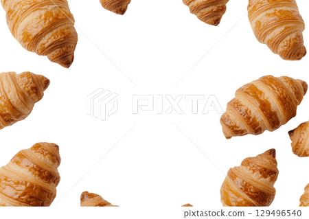 Golden croissants arranged in circular pattern on transparency background 129496540