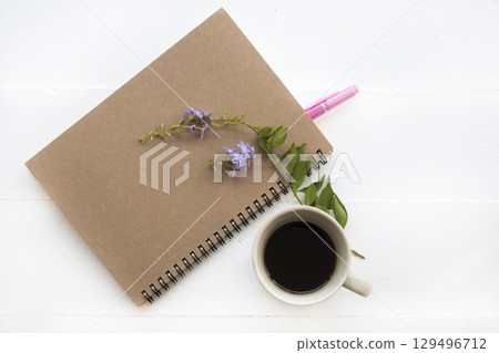 notebook planner with hot coffee arrangement flat lay style notebook planner with hot coffee arrangement flat lay style 129496712
