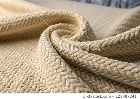 Close-Up View of Soft Textured Fabric in Natural Beige Color for Cozy Home Decor 129497241