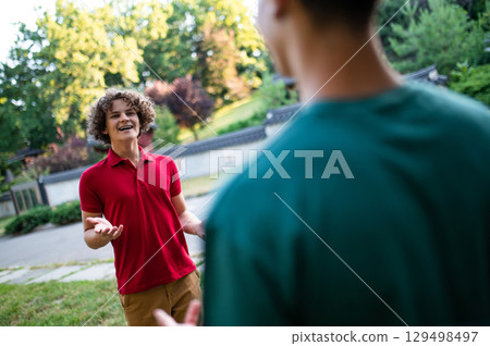 Friends spending time together in the park and looking joyful 129498497