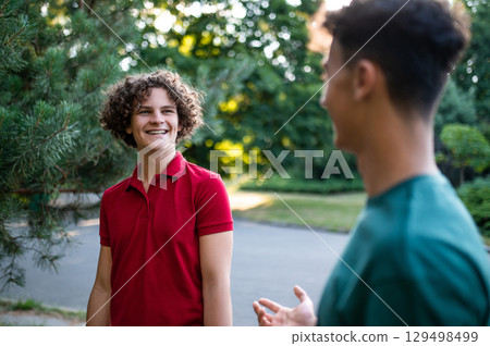 Friends spending time together in the park and looking joyful 129498499