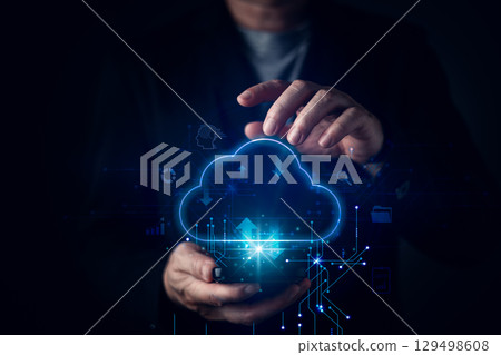 A businessman with a futuristic digital cloud interface, symbolizing cloud computing, data storage, online technology. The glowing elements represent system management, downloads, and innovation. A businessman with a futuristic digital cloud interface, symbolizing cloud computing, data storage, online technology. The glowing elements represent system management, downloads, and innovation. 129498608