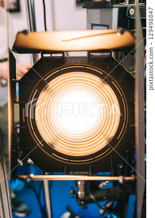 Powerful yellow light source. Continuous light spotlight. Professional stage monoblock with curtains. Narrow beam light source. Lighting equipment, Fresnel lens 129498847