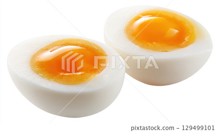 Soft boiled egg halves with bright orange yolk and smooth white surface isolated on white background 129499101