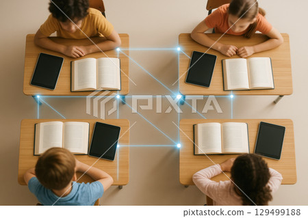 Digital learning in smart classroom uses educational technology to connect students with books and tablets enhancing interactive knowledge sharing and collaborative study experience Digital learning in smart classroom uses educational technology to connect students with books and tablets enhancing interactive knowledge sharing and collaborative study experience 129499188