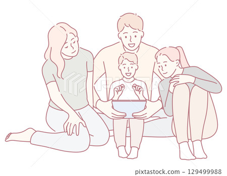 A Family Having Fun and Enjoying Quality Time Together While Engaging with a Tablet 129499988