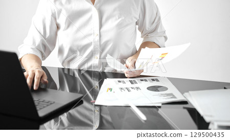 Business concept. A confident gesture by a female leader with leadership and innovative attitude. Business concept. A confident gesture by a female leader with leadership and innovative attitude. 129500435