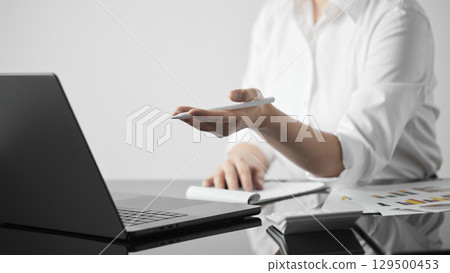 Business concept. A confident gesture by a female leader with leadership and innovative attitude. 129500453