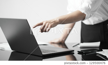 Business concept. A confident gesture by a female leader with leadership and innovative attitude. Business concept. A confident gesture by a female leader with leadership and innovative attitude. 129500476