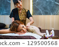 woman is getting  massage from  masseuse 129500568