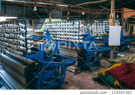 workshop with weaving machines for the production of woven reed mats in Vietnam in Asia workshop with weaving machines for the production of woven reed mats in Vietnam in Asia 129501362