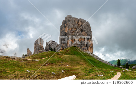 Cinque Torri rock formations in the Dolomites (Dolomiti, Dolomiten), Italy. Majestic stone towers rising above the snowy alpine landscape, a famous spot for climbers and hikers Cinque Torri rock formations in the Dolomites (Dolomiti, Dolomiten), Italy. Majestic stone towers rising above the snowy alpine landscape, a famous spot for climbers and hikers 129502600