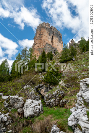 Cinque Torri rock formations in the Dolomites (Dolomiti, Dolomiten), Italy. Majestic stone towers rising above the snowy alpine landscape, a famous spot for climbers and hikers Cinque Torri rock formations in the Dolomites (Dolomiti, Dolomiten), Italy. Majestic stone towers rising above the snowy alpine landscape, a famous spot for climbers and hikers 129502602